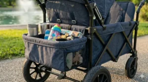 Side view of a double stroller wagon showing an attached insulated storage bag and cup holders.