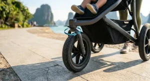 Close-up photorealistic illustration of a 3 wheel stroller’s front swivel wheel showing 360-degree rotation.