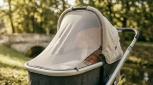 Extendable sun canopy with UV protection pulled over a baby stroller with bassinet.