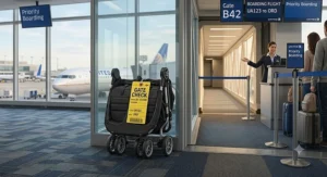 Folded double stroller for airport travel tagged for gate check at the airplane jetway entrance.