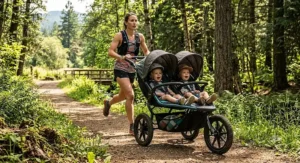 Parent trail running through a wooded park pushing a side-by-side double all-terrain stroller