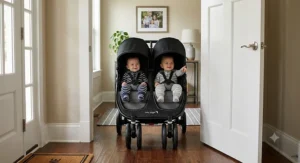 Side-by-side double stroller for twins fitting through a standard American residential doorway.