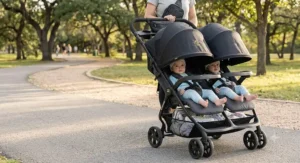 Side-by-side double stroller with dual extended UV sun canopies protecting twin babies.