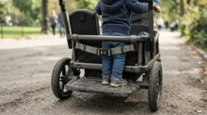An economic sit-and-stand stroller under $200 focused on the sturdy rear standing board and safety harness for growing kids.