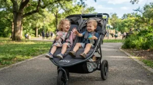 Two older children comfortably sitting in a lightweight twin travel stroller for toddlers.