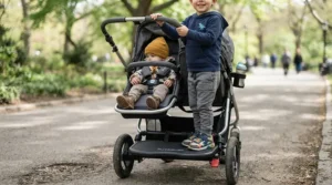 Close-up of the rear standing platform on a sit-and-stand stroller for toddler and preschooler.